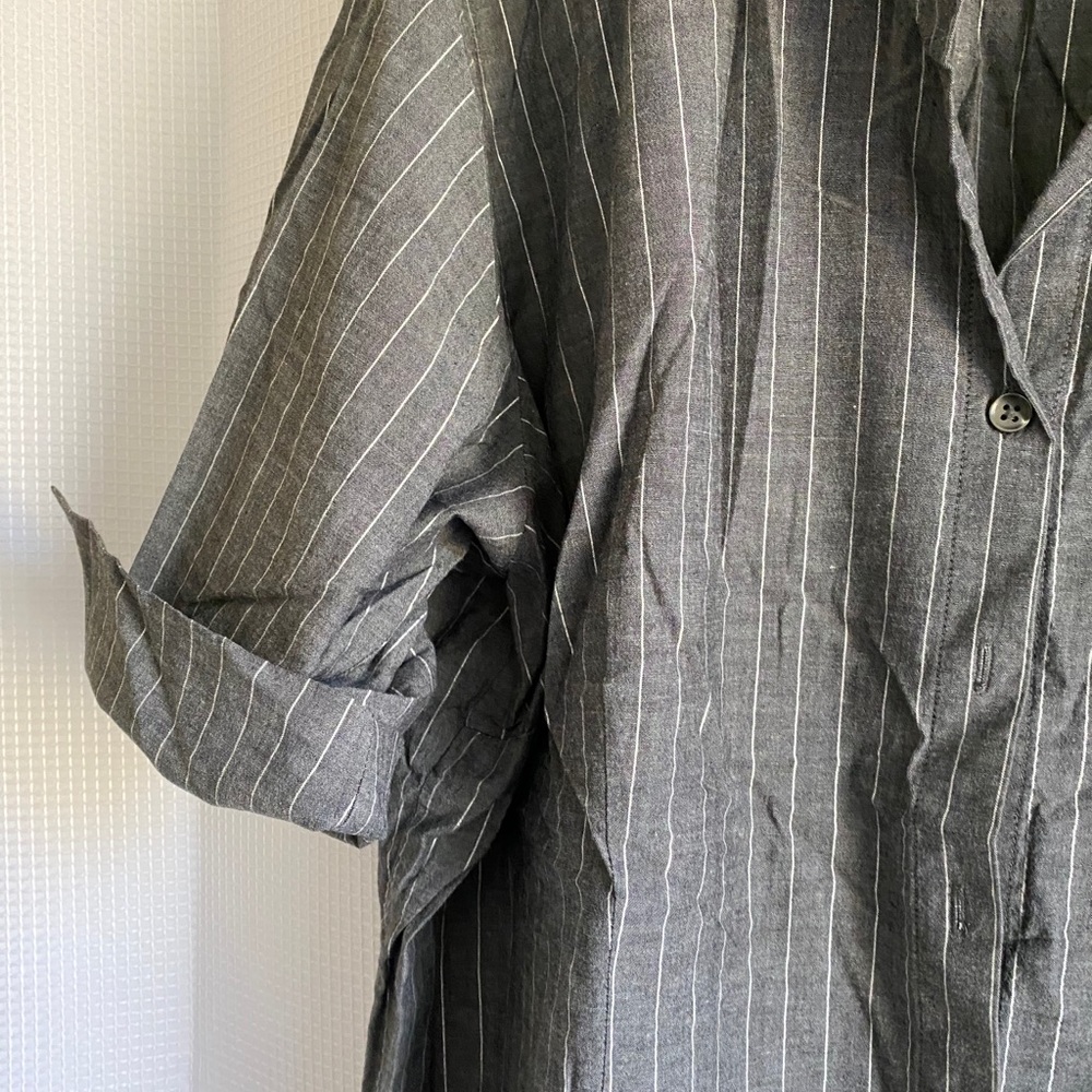 Gray and white striped shirt.